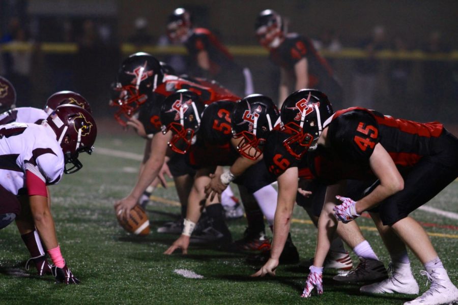 Cavos+offensive+line+is+about+to+snap+the+ball+against+rival+Park+Ridge+in+the+Homecoming+game.+The+Cavos+went+5+-+5+last+season.